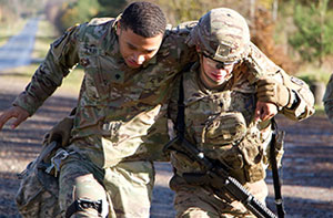 soldier helping another solider