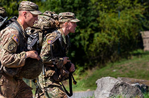 soldiers walking near water